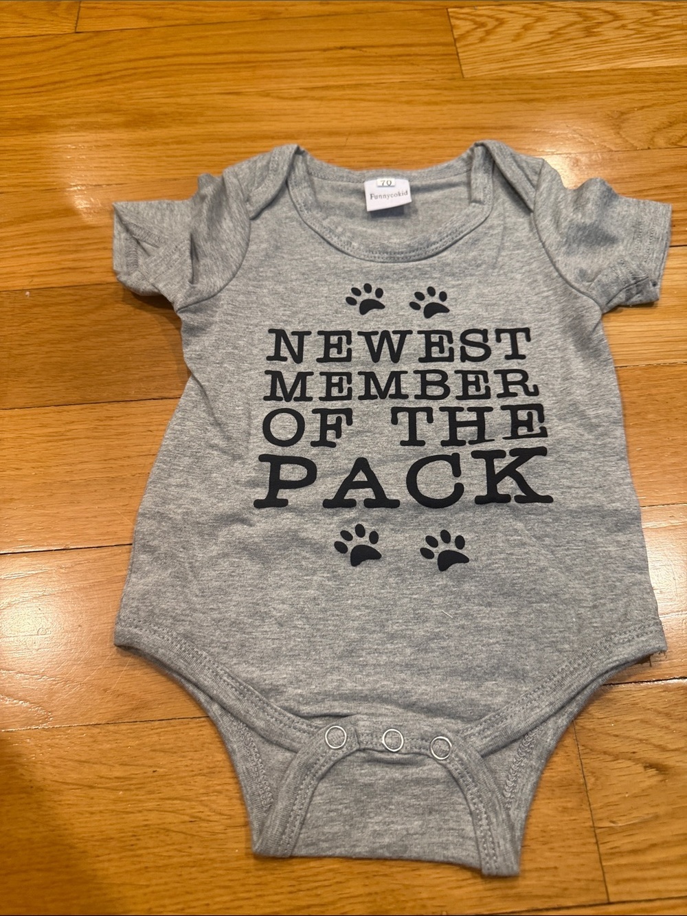 Funnycokid baby onesie Newest Member of the pack size 0-3.
